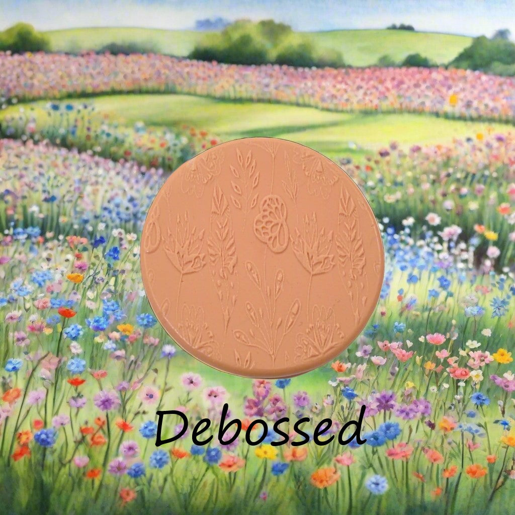 Flowers embossed in silly putty Using a debossed texture mat. This will give you an idea of what it will look like on metal clay or polymer clay