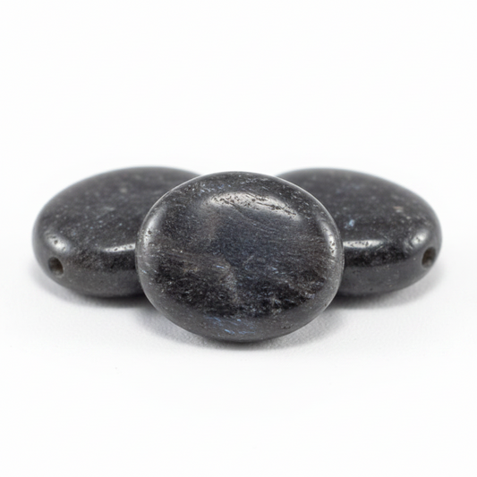 Three dark gray beads on a white background