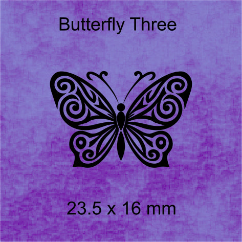 Butterfly design with intricate patterns on a blue background, labeled 'Butterfly Three' and dimensions '23.5 x 16 mm'.