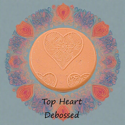 A Celtic pattern embossed in silly putty Using a debossed texture mat in grey material. This will give you an idea of what it will look like on metal clay or polymer clay.