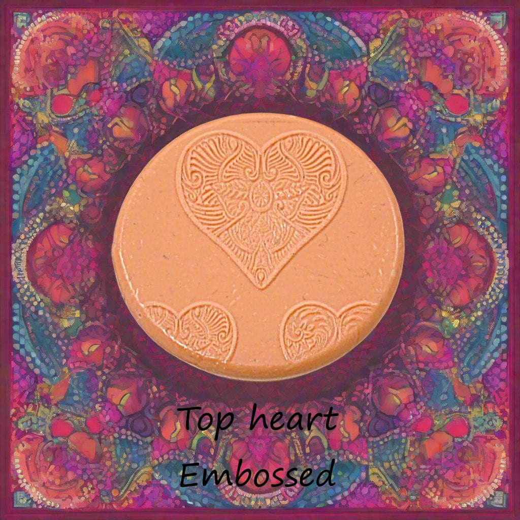 A Celtic heart debossed in silly putty Using an embossed texture mat in grey material. This will give you an idea of what it will look like on metal clay or polymer clay.