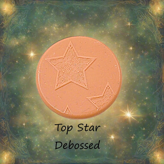 A Celtic star pattern embossed in silly putty Using a debossed texture mat in grey material. This will give you an idea of what it will look like on metal clay or polymer clay.