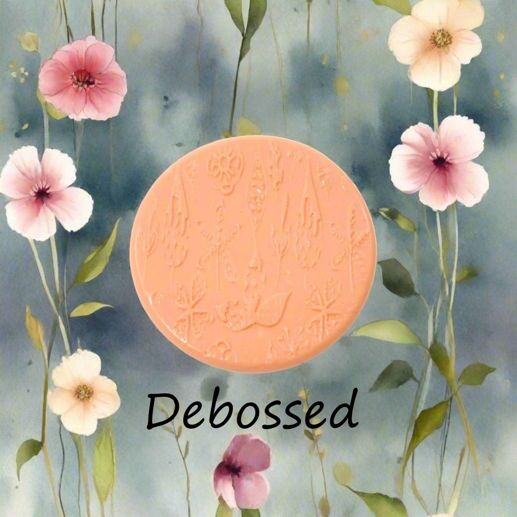 Flowers embossed in silly putty Using a debossed texture mat. This will give you an idea of what it will look like on metal clay or polymer clay