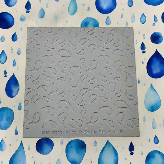 A raindrop pattern debossed texture mat in grey material. This texture mat will give you an embossed effect on metal clay or polymer clay.