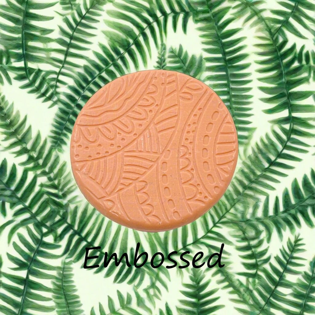 A pattern debossed in silly putty Using a patterned embossed texture mat in grey material. This will give you an idea of what it will look like on metal clay or polymer clay.