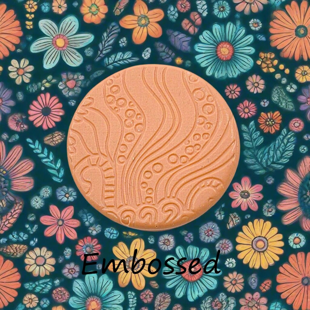 A pattern debossed in silly putty Using a patterned embossed texture mat in grey material. This will give you an idea of what it will look like on metal clay or polymer clay.