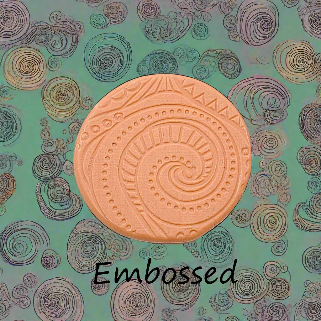 A pattern debossed in silly putty Using a patterned embossed texture mat in grey material. This will give you an idea of what it will look like on metal clay or polymer clay.