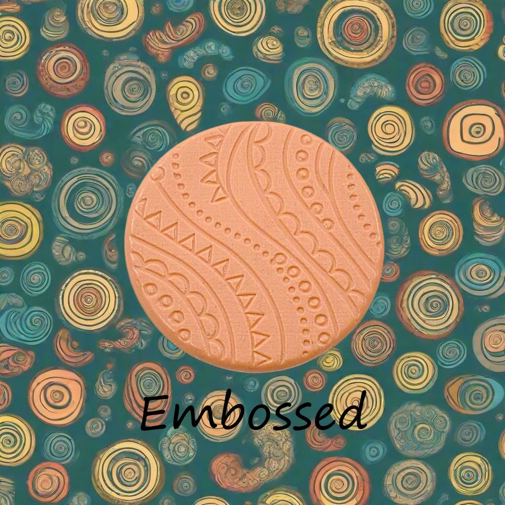 A pattern debossed in silly putty Using a patterned embossed texture mat in grey material. This will give you an idea of what it will look like on metal clay or polymer clay.