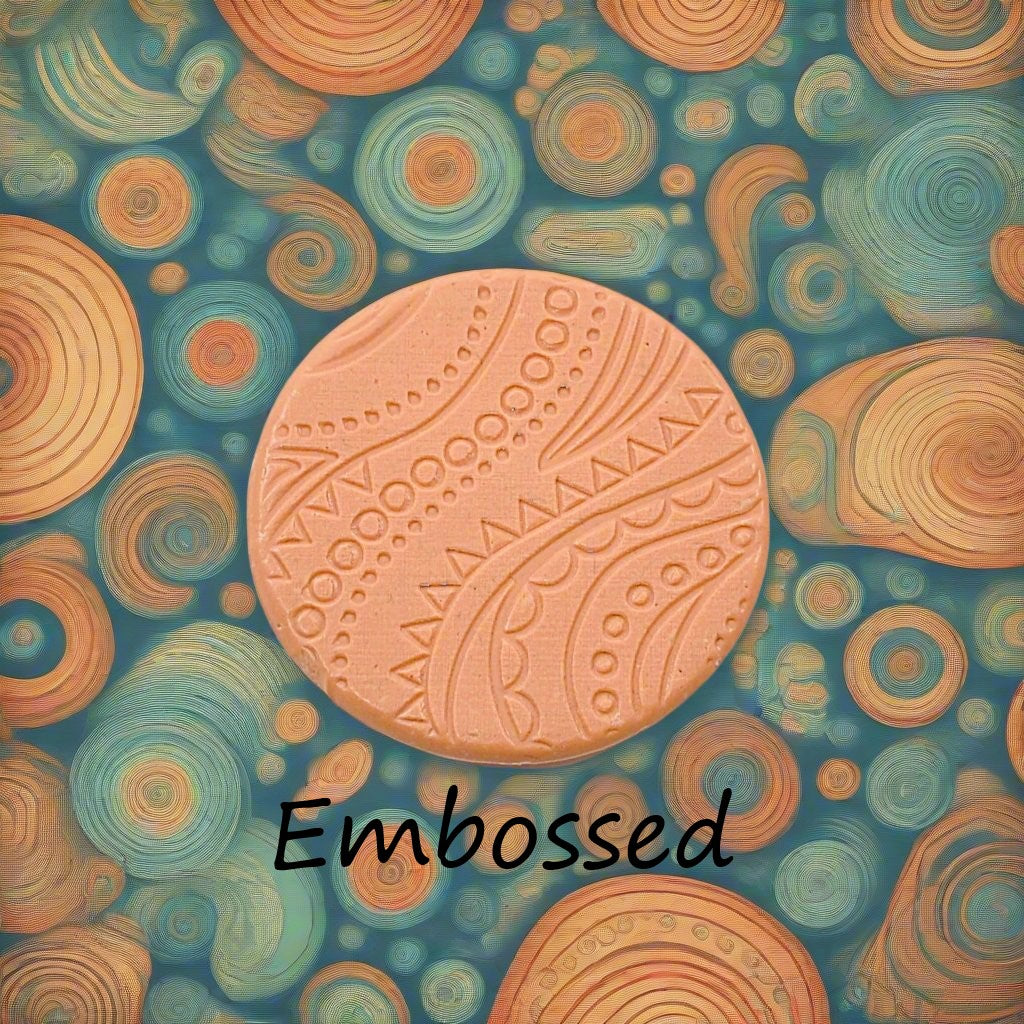 A pattern debossed in silly putty Using a patterned embossed texture mat in grey material. This will give you an idea of what it will look like on metal clay or polymer clay.