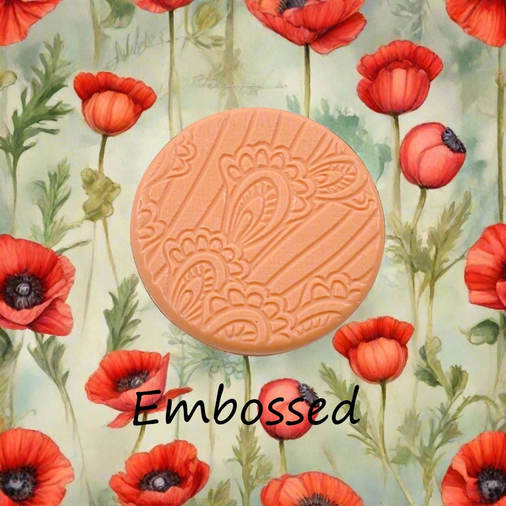 A pattern debossed in silly putty Using a patterned embossed texture mat in grey material. This will give you an idea of what it will look like on metal clay or polymer clay.