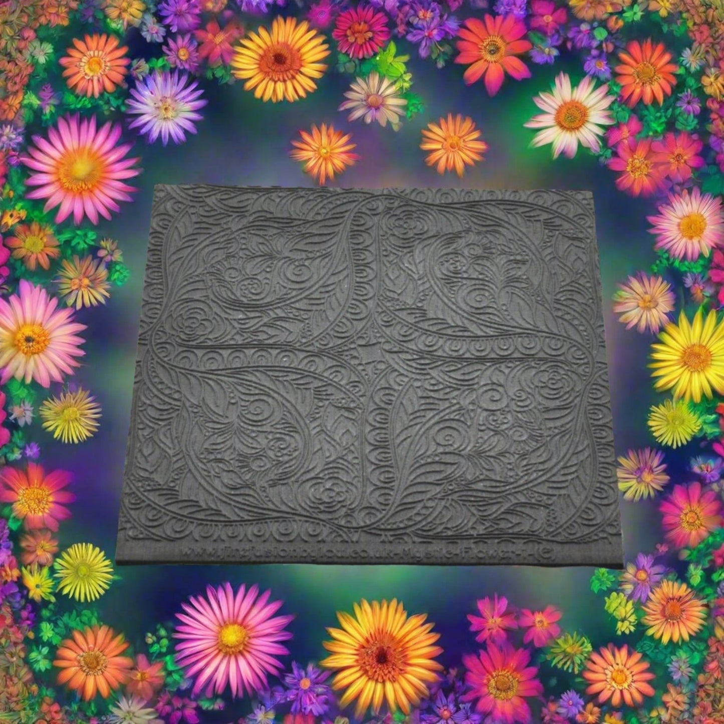 Embossed Flowery mandala style texture mat with. Use to make an impression on metal clay and polymer