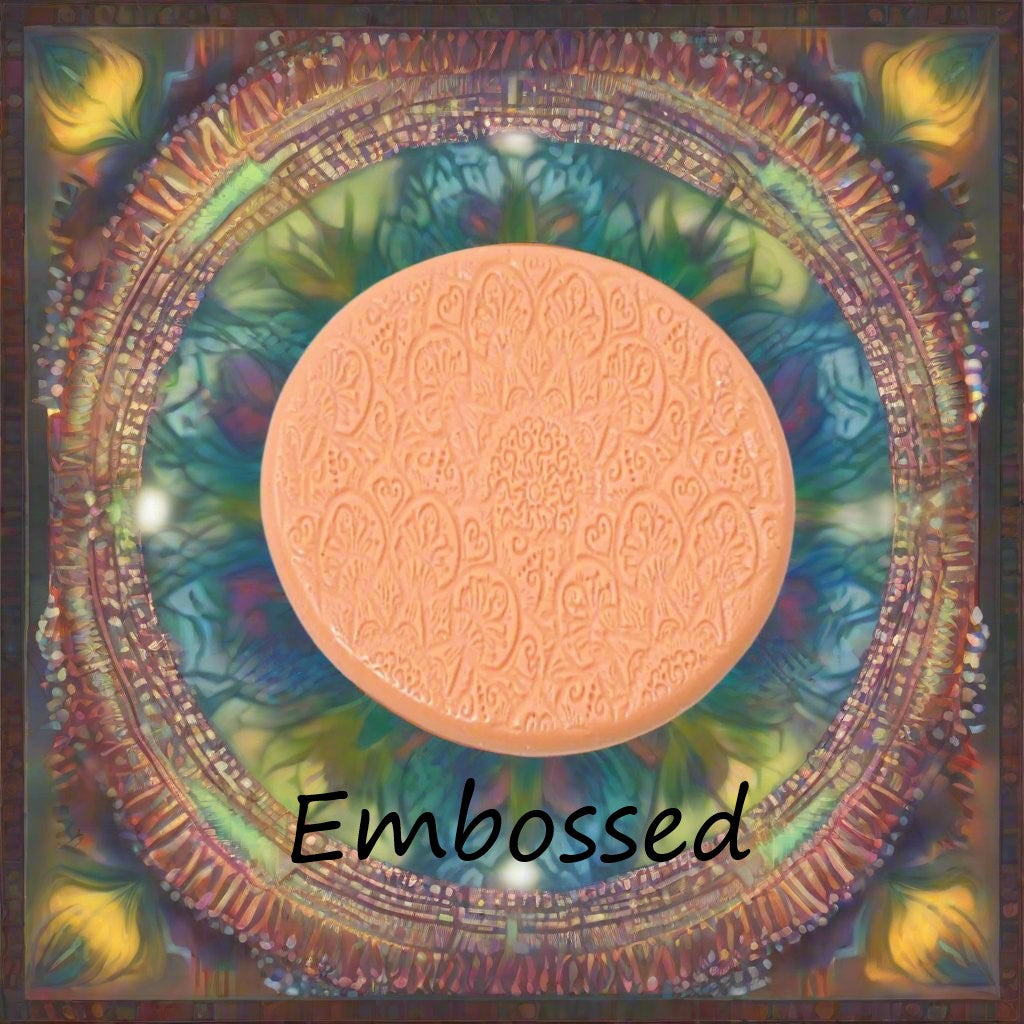 A flower mandala debossed in silly putty Using a embossed texture mat. This will give you an idea of what it will look like on metal clay or polymer clay.