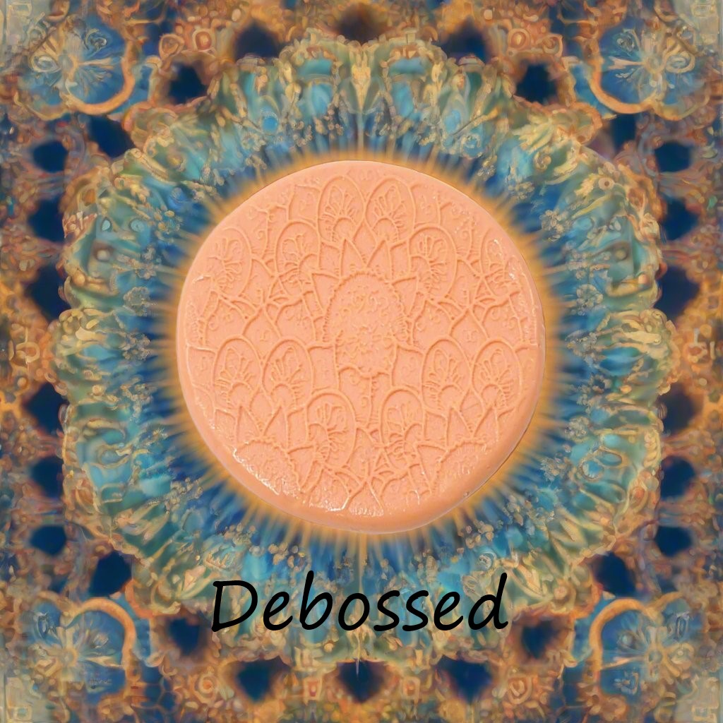 A flowery mandala pattern embossed in silly putty Using a debossed texture mat in grey material. This will give you an idea of what it will look like on metal clay or polymer clay.