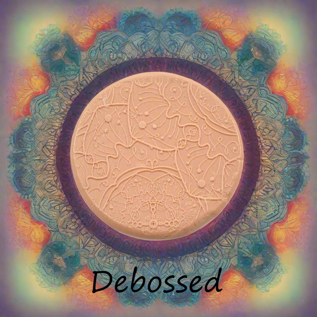 A flower mandala embossed in silly putty Using a debossed texture mat. This will give you an idea of what it will look like on metal clay or polymer clay.
