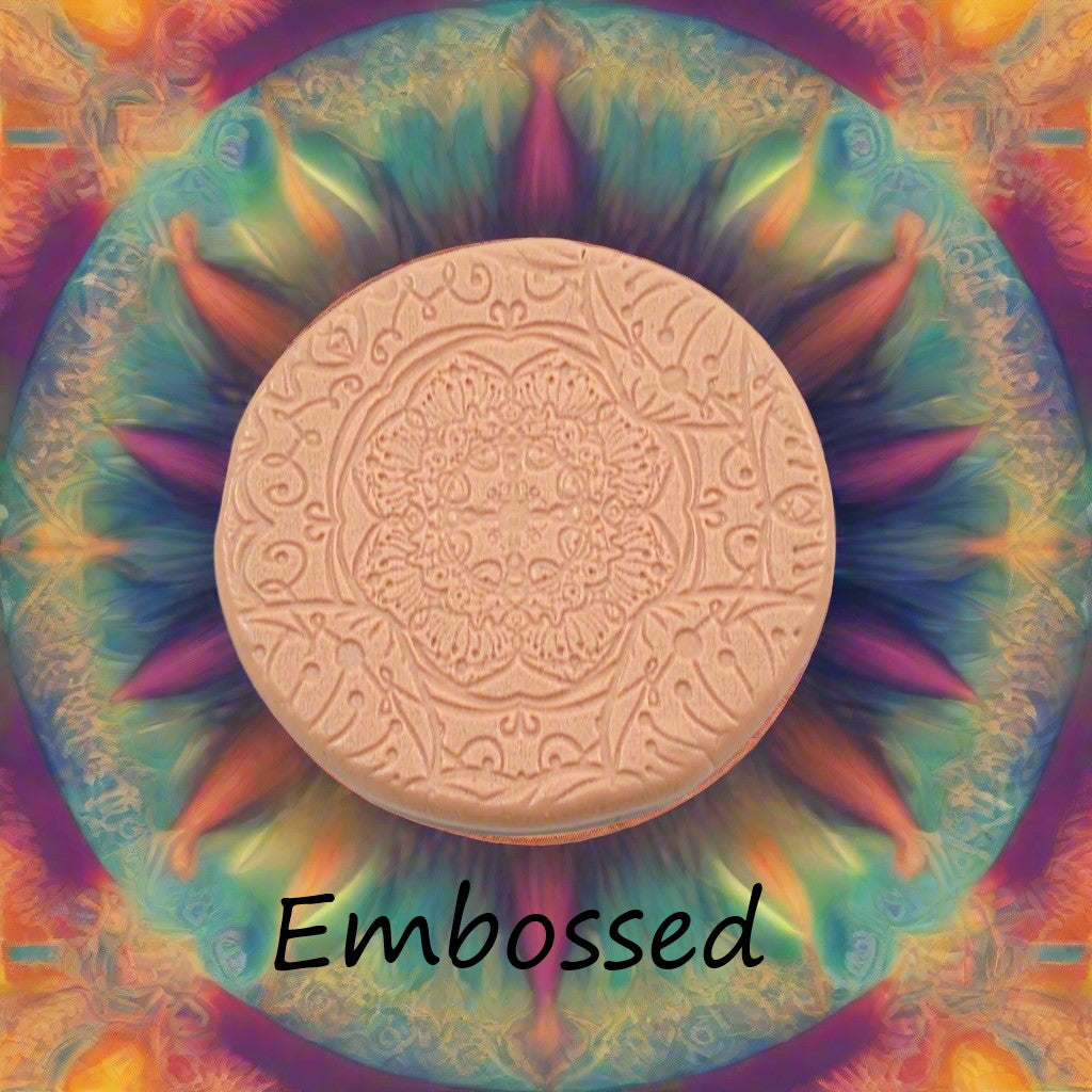 A flower mandala debossed in silly putty Using a embossed texture mat. This will give you an idea of what it will look like on metal clay or polymer clay.