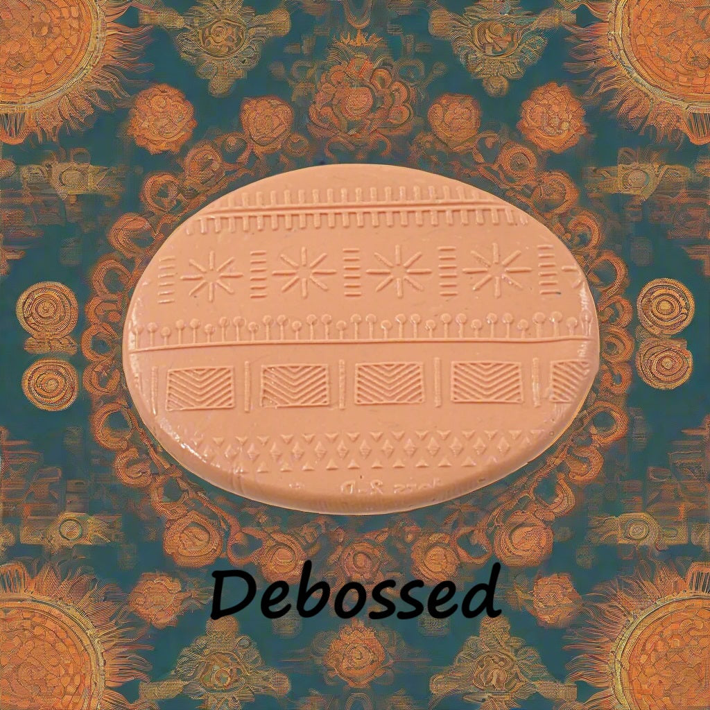 A pattern embossed in silly putty Using an ethnic design debossed texture mat in grey material. This will give you an idea of what it will look like on metal clay or polymer clay.