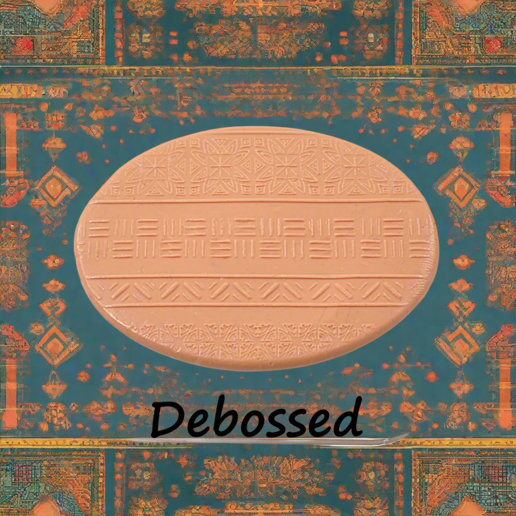 A pattern embossed in silly putty Using an ethnic design debossed texture mat in grey material. This will give you an idea of what it will look like on metal clay or polymer clay.