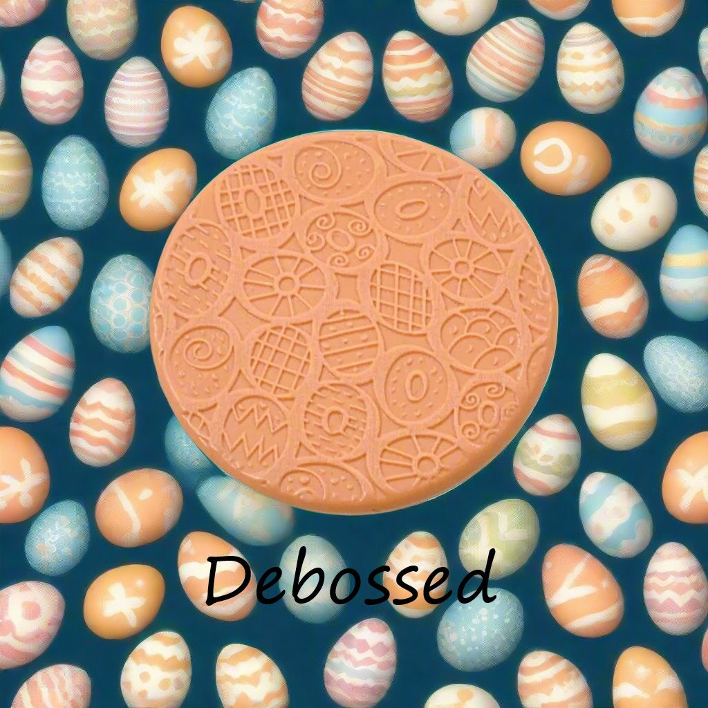 A pattern embossed in silly putty Using a patterned debossed texture mat in grey material. This will give you an idea of what it will look like on metal clay or polymer clay.