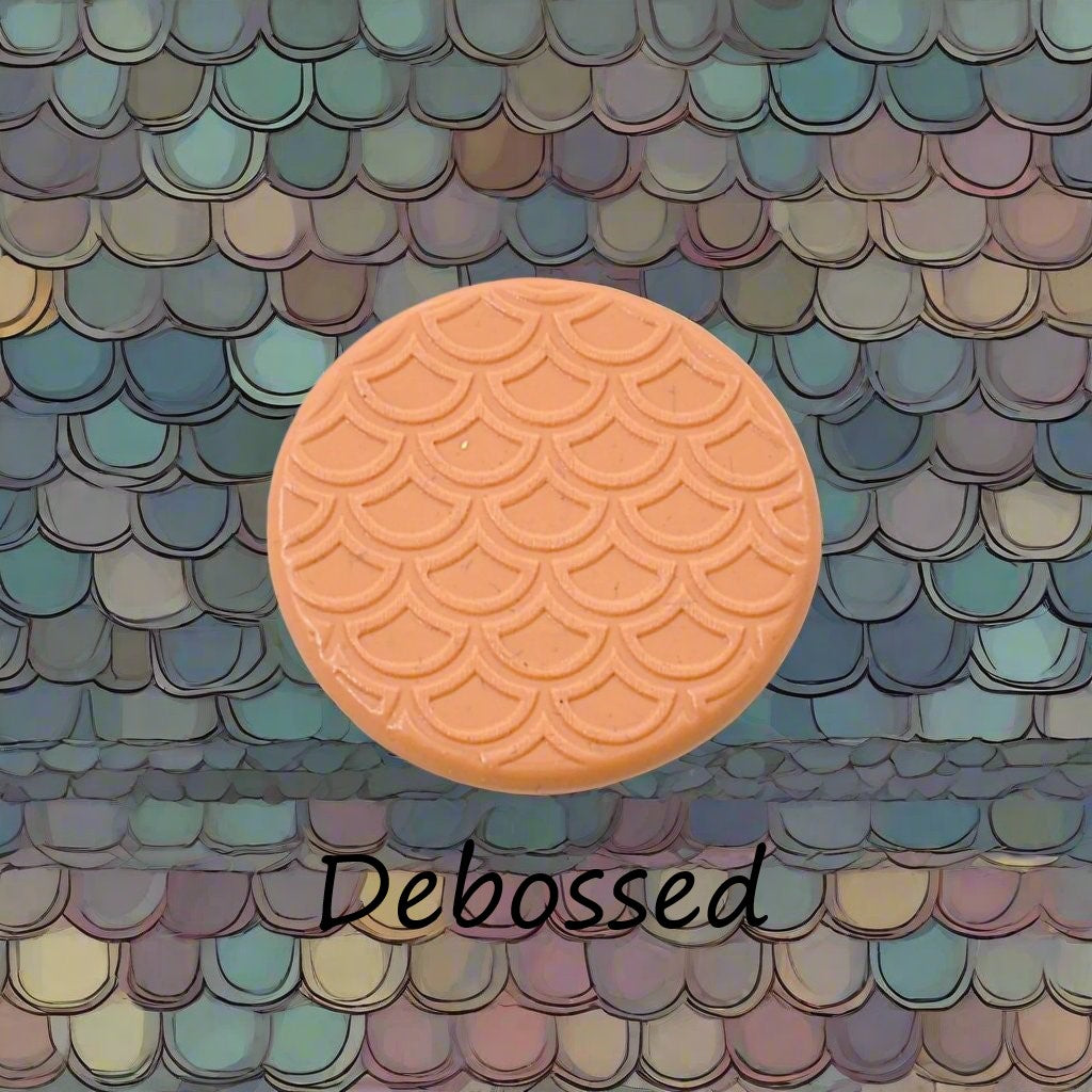 A pattern embossed in silly putty Using a patterned debossed texture mat in grey material. This will give you an idea of what it will look like on metal clay or polymer clay.