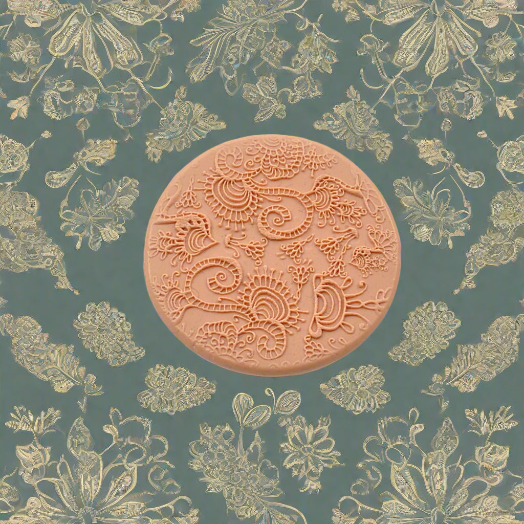 A floral pattern embossed in silly putty Using a debossed texture mat. This will give you an idea of what it will look like on metal clay or polymer clay.