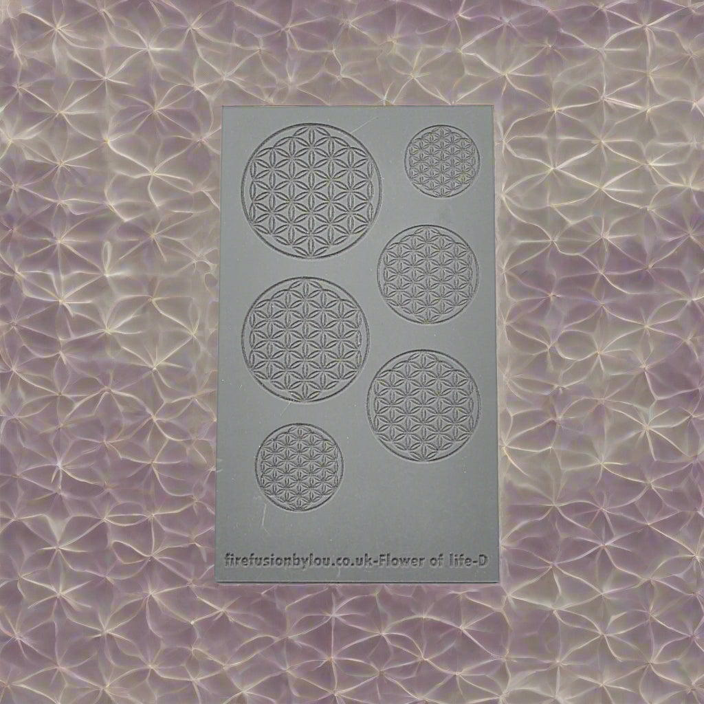A 95 x 55 mm debossed texture mat with a geometric flower of life repeat design. Use to make a embossed impression on metal clay and polymer clay