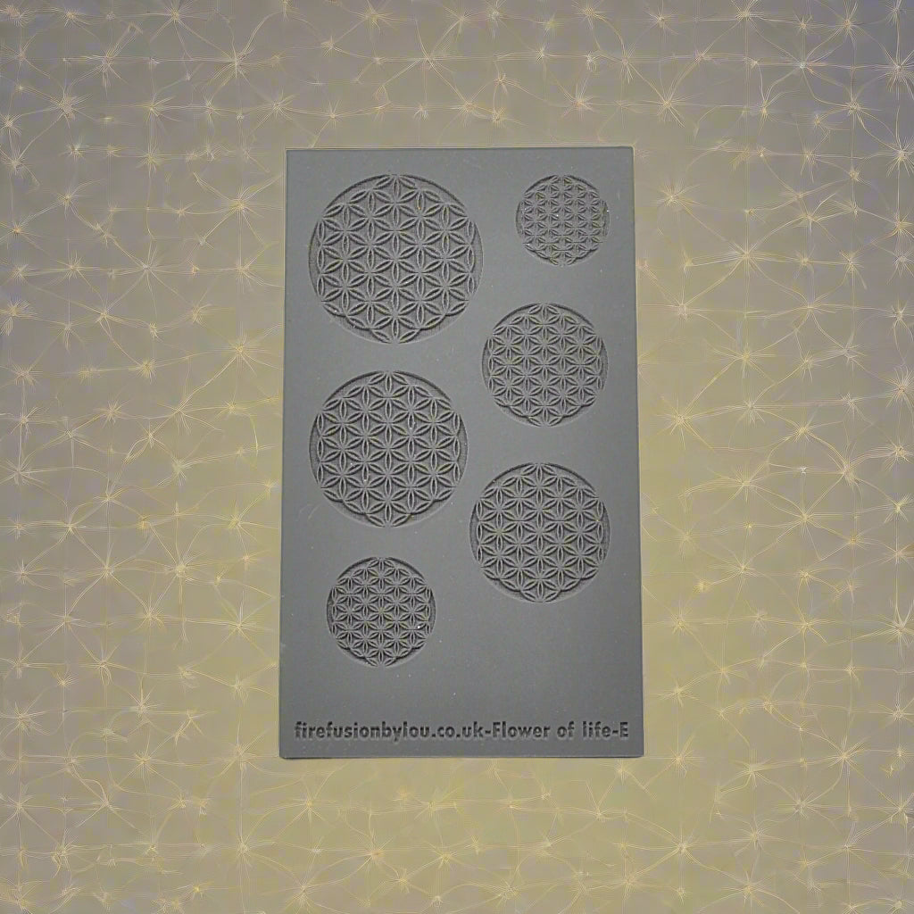 A 95 x 55 mm embossed texture mat with a geometric flower of life repeat design. Use to make a debossed impression on metal clay and polymer clay