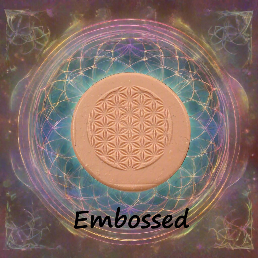 Flower of Life design debossed in silly putty Using an embossed texture mat. This will give you an idea of what it will look like on metal clay or polymer clay