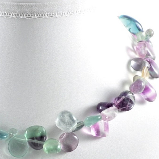 Necklace with multicolored beads on a white background