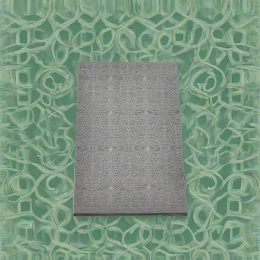 fancy geometric debossed texture mat in grey material. The texture mat pattern will give a embossed effect on metal clay or polymer clay.
