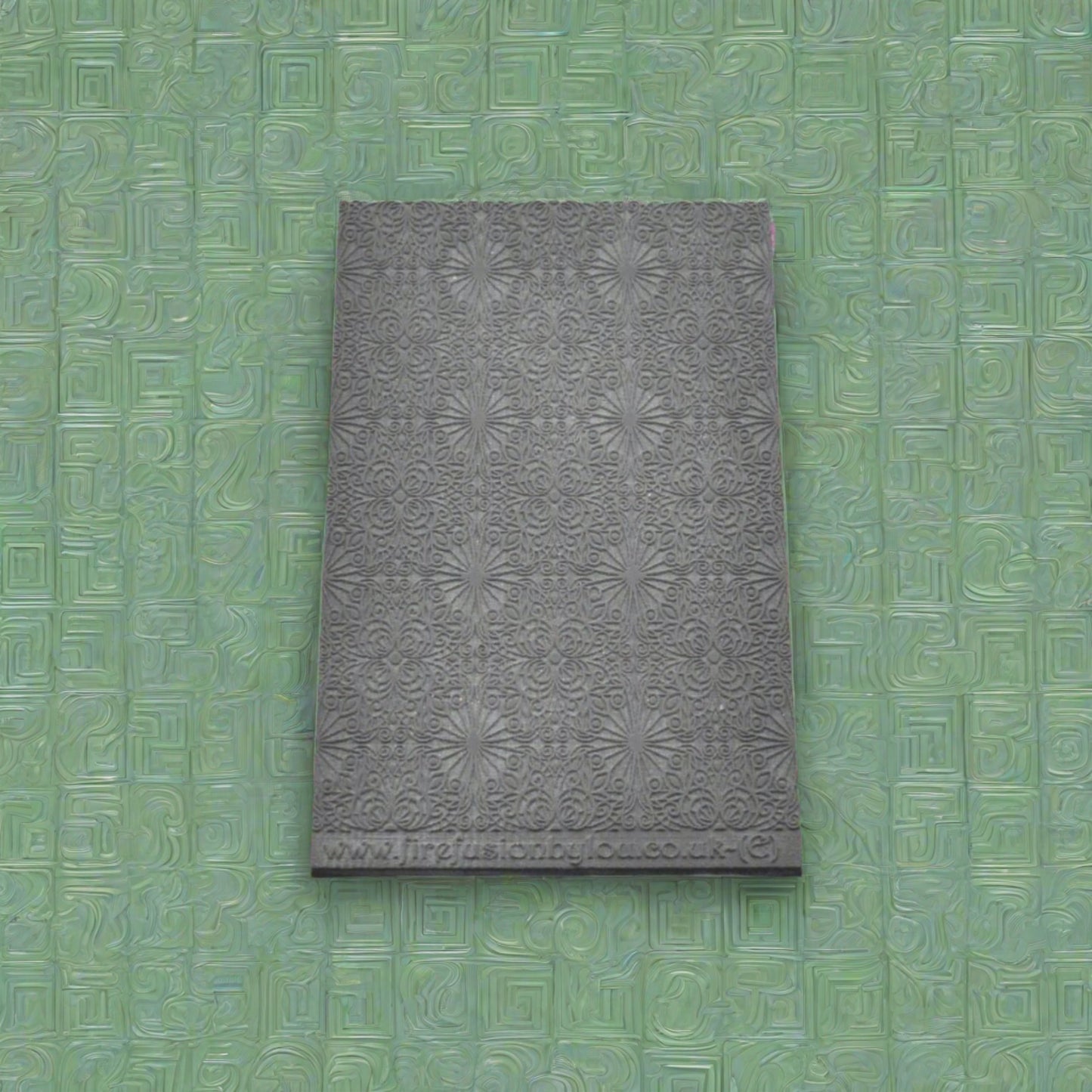 fancy geometric embossed texture mat in grey material. The texture mat pattern will give a debossed effect on metal clay or polymer clay.