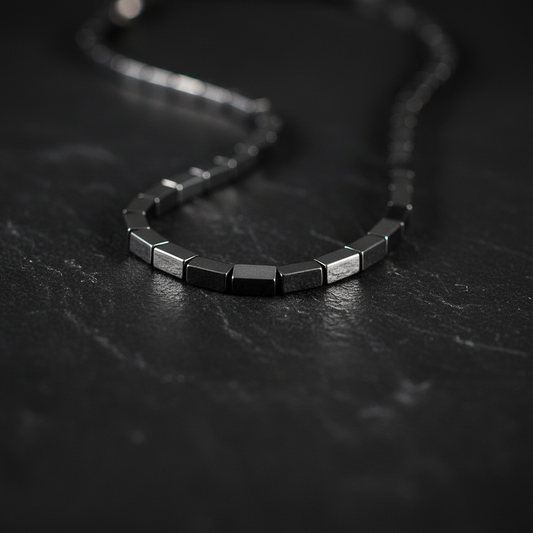 "Close up of hematite cube beads 8mm by 4mm showing rectangular geometric shape and polished metallic surface"