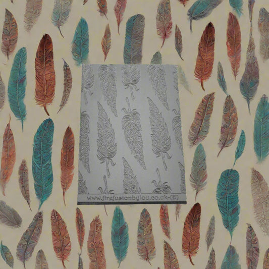 A tribal feather pattern debossed texture mat in grey material. This texture mat will give you an embossed effect on metal clay or polymer clay.