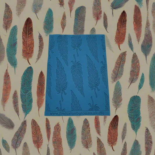 A tribal feather pattern debossed texture mat in grey material. This texture mat will give you an embossed effect on metal clay or polymer clay.