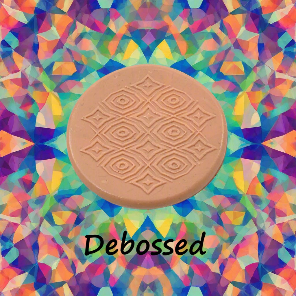 A pattern embossed in silly putty Using a patterned debossed texture mat in grey material. This will give you an idea of what it will look like on metal clay or polymer clay.