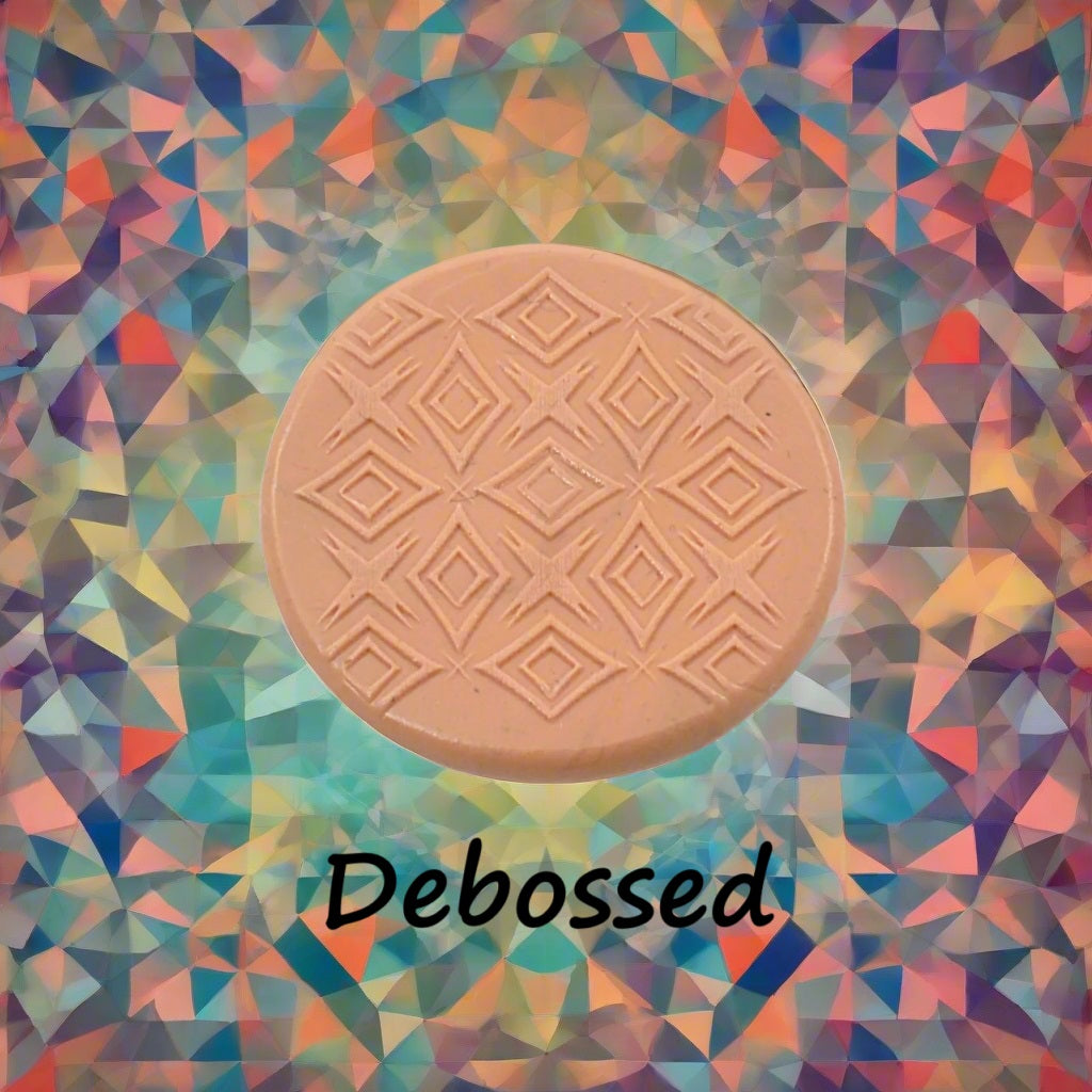 A pattern embossed in silly putty Using a patterned debossed texture mat in grey material. This will give you an idea of what it will look like on metal clay or polymer clay.