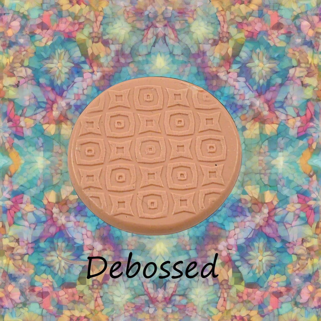 A pattern embossed in silly putty Using a patterned debossed texture mat in grey material. This will give you an idea of what it will look like on metal clay or polymer clay.