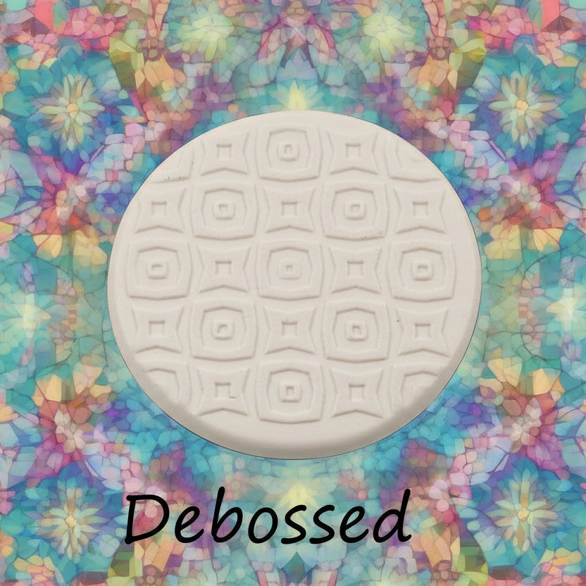 A pattern embossed in silly putty Using a patterned debossed texture mat in grey material. This will give you an idea of what it will look like on metal clay or polymer clay.
