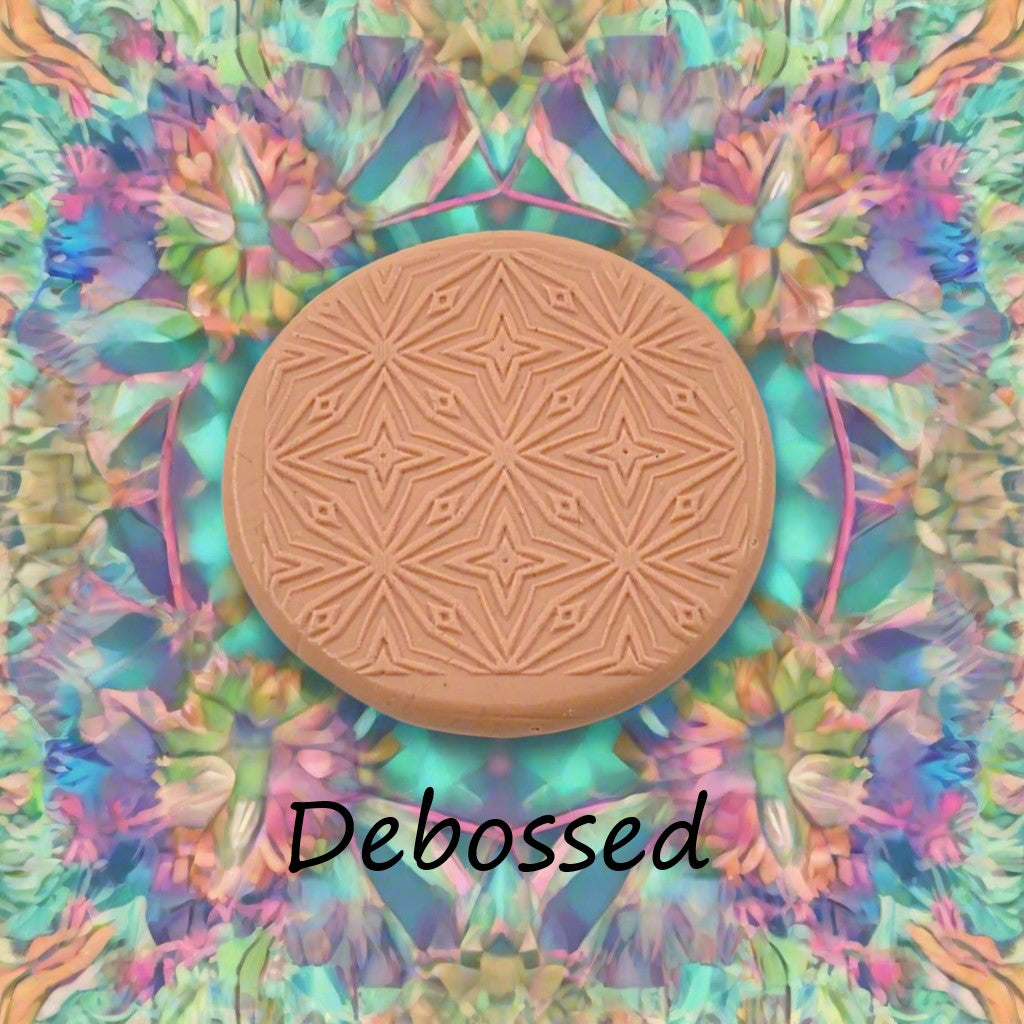 A pattern embossed in silly putty Using a patterned debossed texture mat in grey material. This will give you an idea of what it will look like on metal clay or polymer clay.