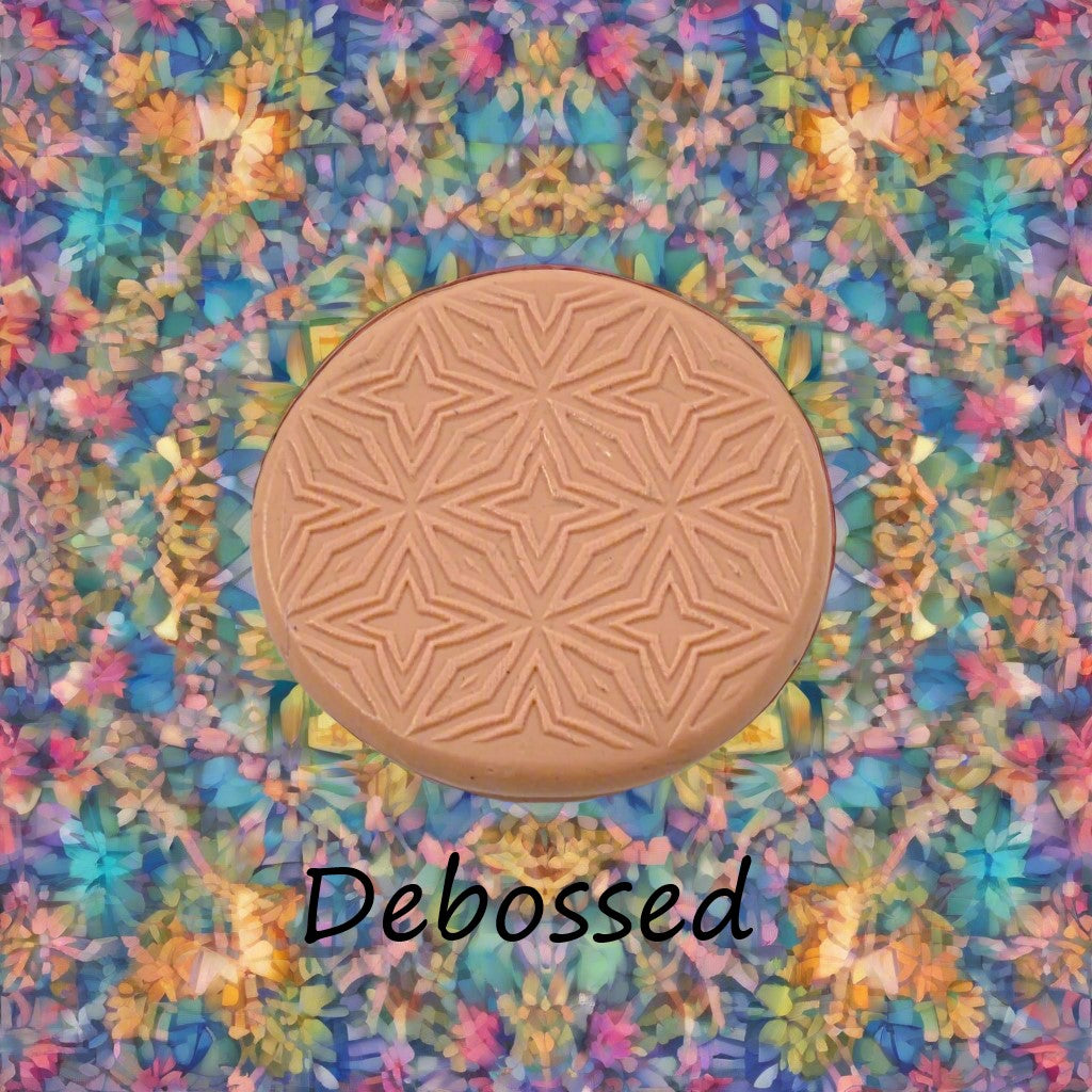 A pattern embossed in silly putty Using a patterned debossed texture mat in grey material. This will give you an idea of what it will look like on metal clay or polymer clay.
