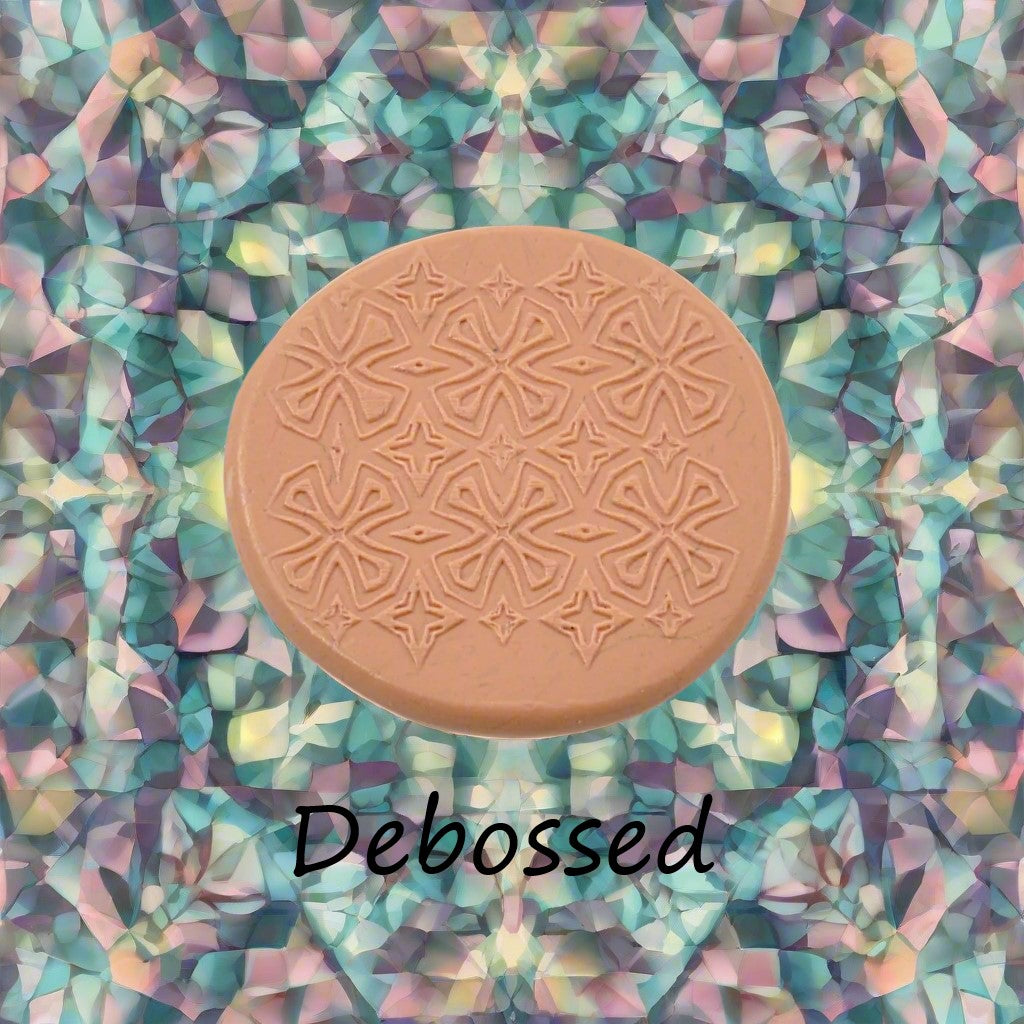 A pattern embossed in silly putty Using a patterned debossed texture mat in grey material. This will give you an idea of what it will look like on metal clay or polymer clay.