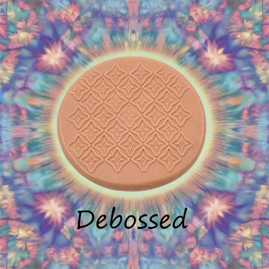 A pattern embossed in silly putty Using a patterned debossed texture mat in grey material. This will give you an idea of what it will look like on metal clay or polymer clay.