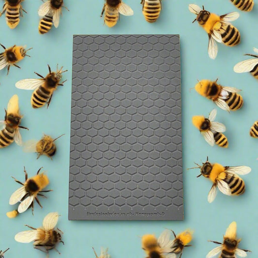A 95 x 55 mm debossed texture mat in a honeycomb repeat design. Use to make a embossed impression on metal clay and polymer clay.