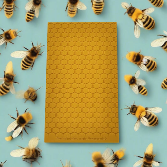 A 95 x 55 mm debossed texture mat in a honeycomb repeat design. Use to make a embossed impression on metal clay and polymer clay.