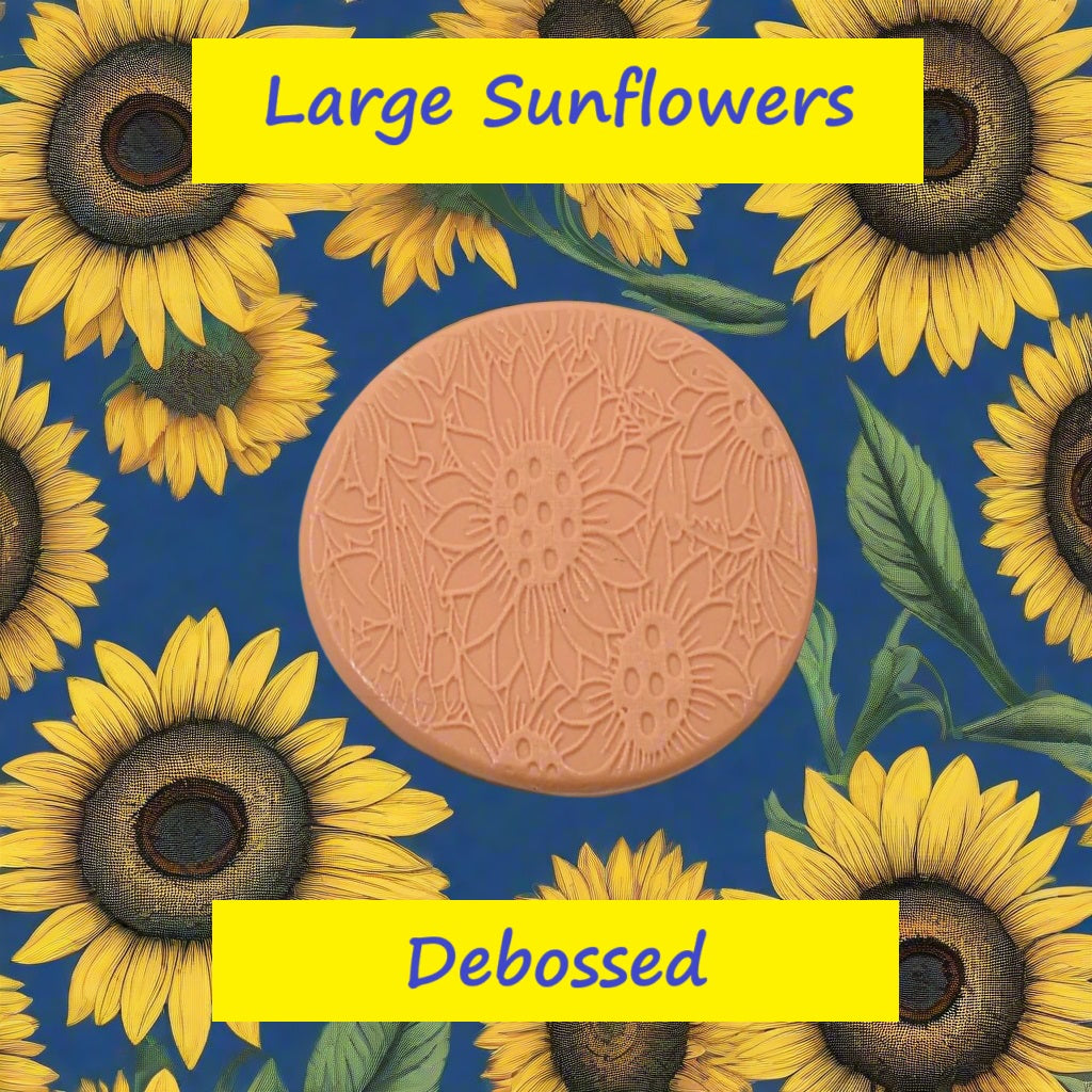 A large sunflower pattern embossed in silly putty Using a large sunflower patterned debossed texture mat in grey material. This will give you an idea of what it will look like on metal clay or polymer clay.