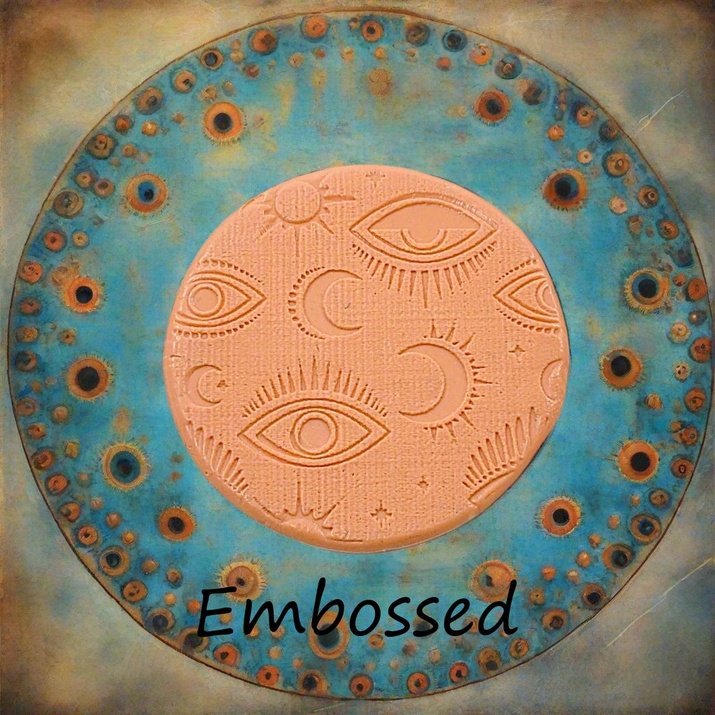 A mystical eye pattern debossed in silly putty Using a patterned embossed texture mat in grey material. This will give you an idea of what it will look like on metal clay or polymer clay.