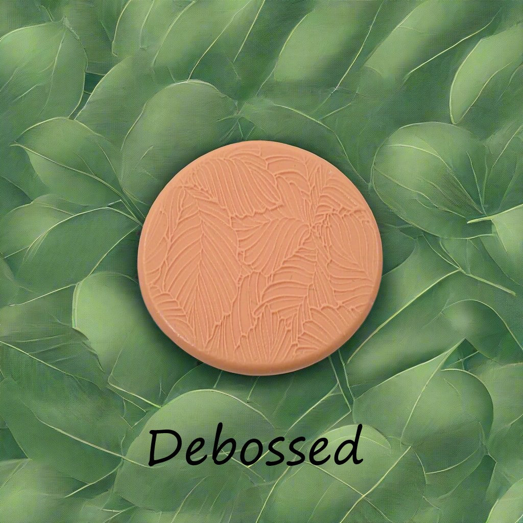 Leaves embossed in silly putty using a debossed texture mat. This will give you an idea of what it will look like on metal clay or polymer clay