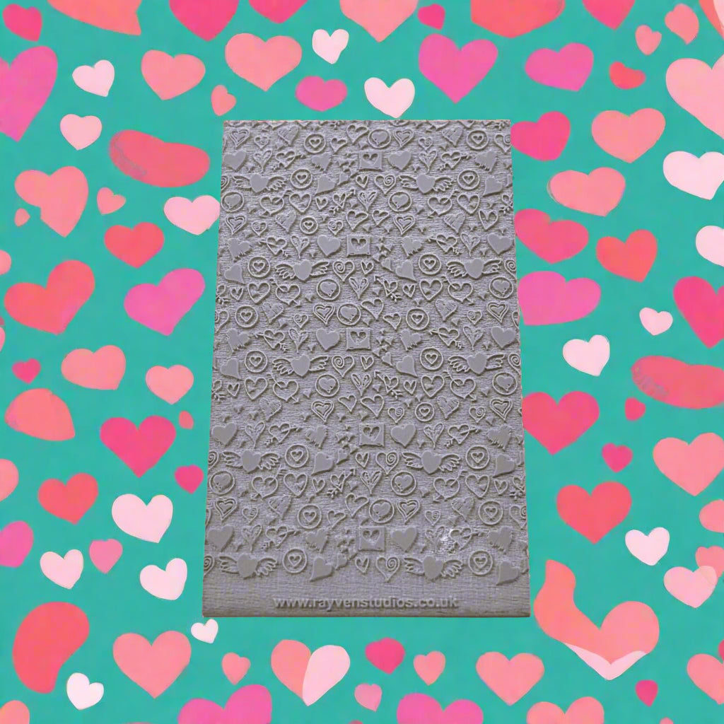 A embossed hearts design texture mat will give a debossed texture design on metal clay and polymer