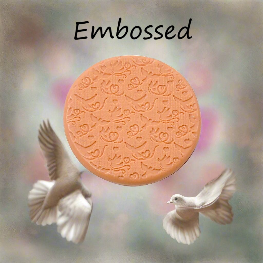 A pattern debossed in silly putty Using a patterned embossed texture mat in grey material. This will give you an idea of what it will look like on metal clay or polymer clay.