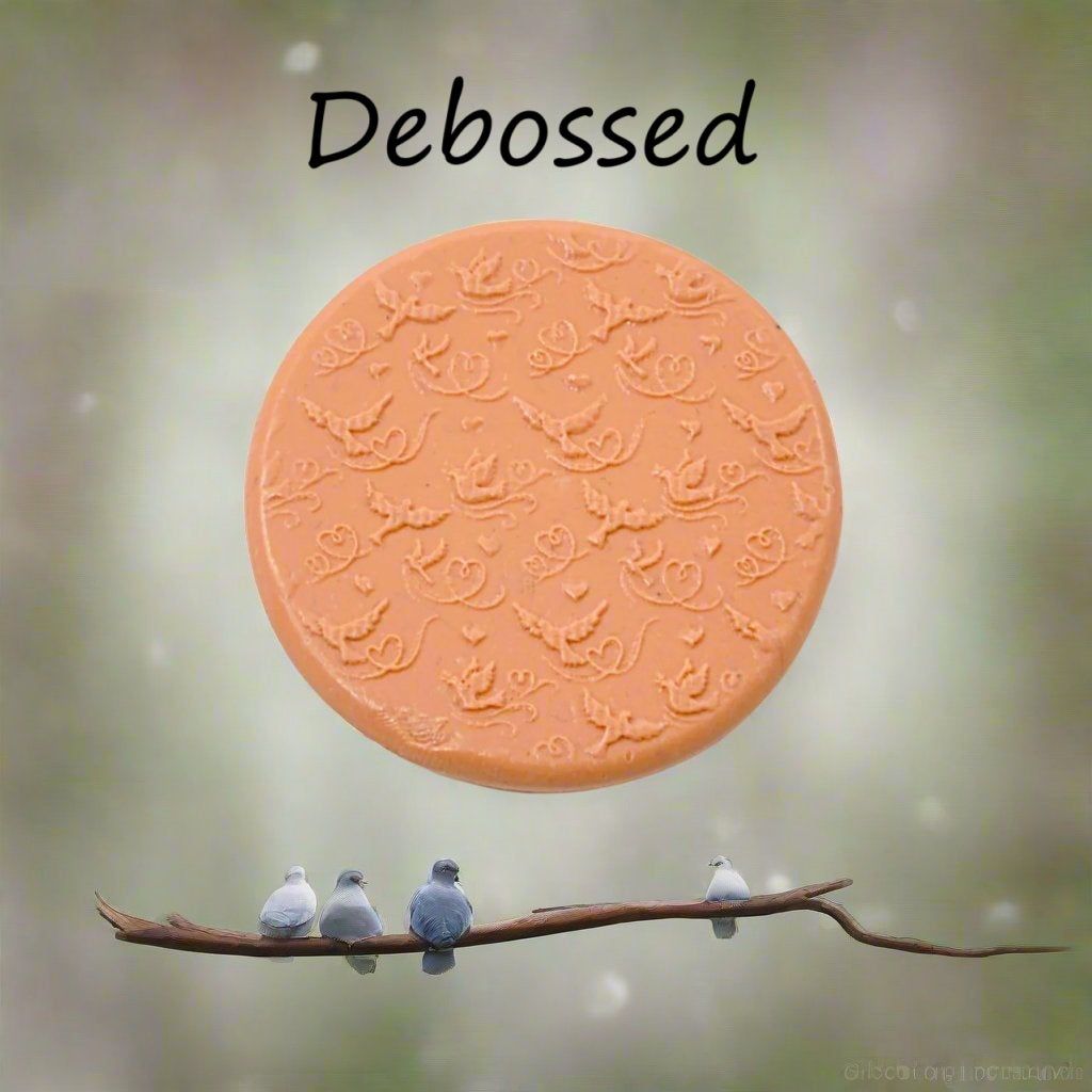 A pattern embossed in silly putty Using a patterned debossed texture mat in grey material. This will give you an idea of what it will look like on metal clay or polymer clay.