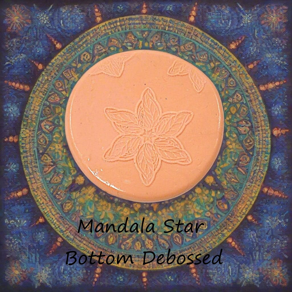 A star flower mandala embossed in silly putty Using a debossed texture mat. This will give you an idea of what it will look like on metal clay or polymer clay.